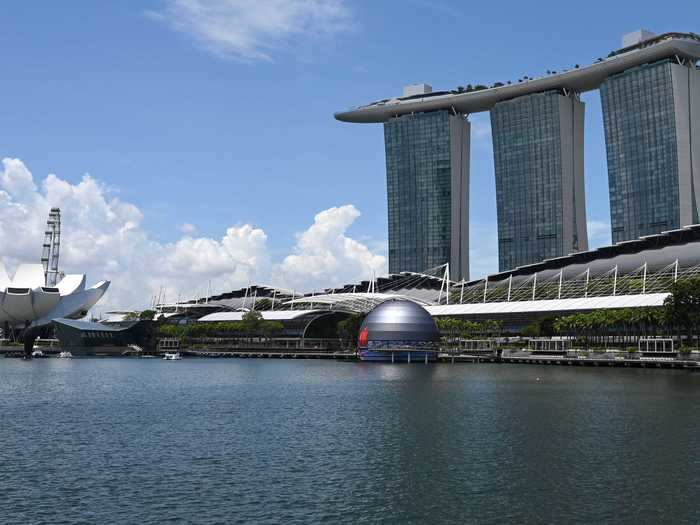 The iconic Marina Bay Sands resort and hotel towers over the new store.