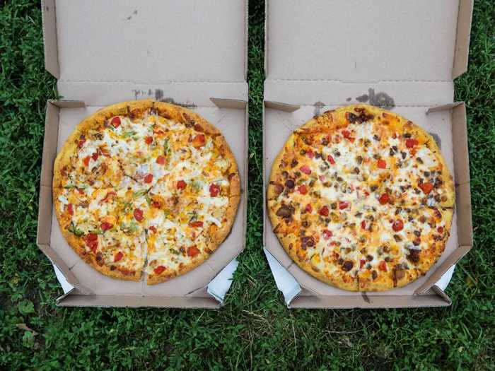 Our pizzas arrived via contactless delivery and assumed their place at the center of our coven in the grass.