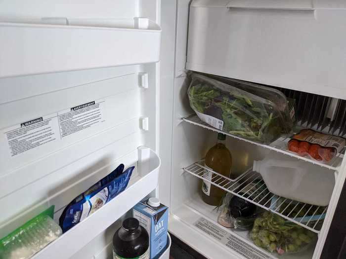 The fridge was quite small. As you can see, a gallon jug, laid sideways, took up almost an entire shelf.