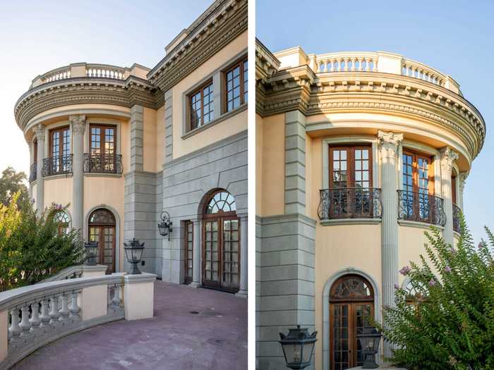 French doors open up to stone terraces and Juliette balconies with wrought-iron and gold leafing railings.