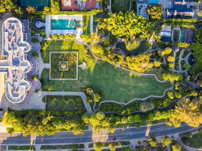 Located 15 minutes north of downtown Los Angeles, the 4.5-acre property consists of a 16-bedroom main residence, two-bedroom guest house, and landscaped gardens.