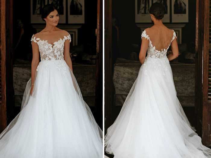 The dress features a lace bodice and a tulle skirt.