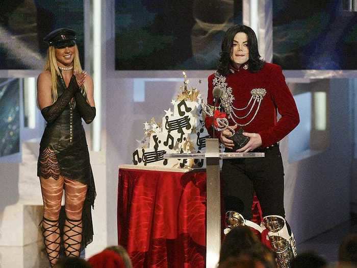 Britney Spears wore a leather outfit as she presented Michael Jackson with a birthday cake.