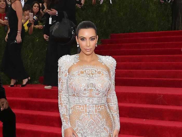 The Roberto Cavalli dress Kardashian West wore to the 2015 Met Gala was covered in jewels and feathers.