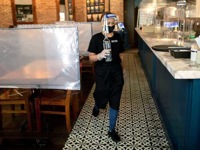 Restaurants were allowed to open at 30% capacity, and some used plastic partitions to protect guests and employees.