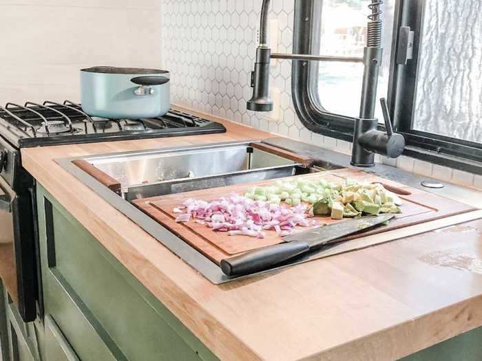 Butcher countertops and a farmhouse sink make a statement in the space.