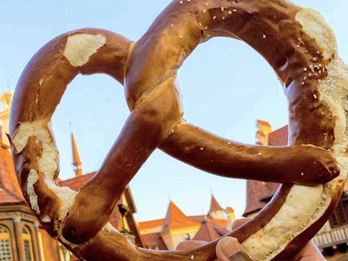 Once visitors cross into Epcot in Disney World, park-goers can taste foods from around the world — like this giant pretzel inspired by German street food.