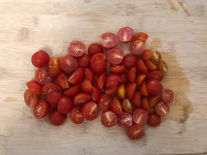 I started by halving the cherry tomatoes, the stars of this pasta dish.