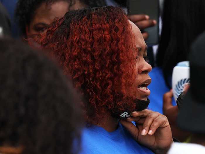 A number of family members who have lost loved ones to police shootings spoke at the rally. The mother of Breonna Taylor, who was fatally shot in a Louisville police raid, said, "What we need is change. And we