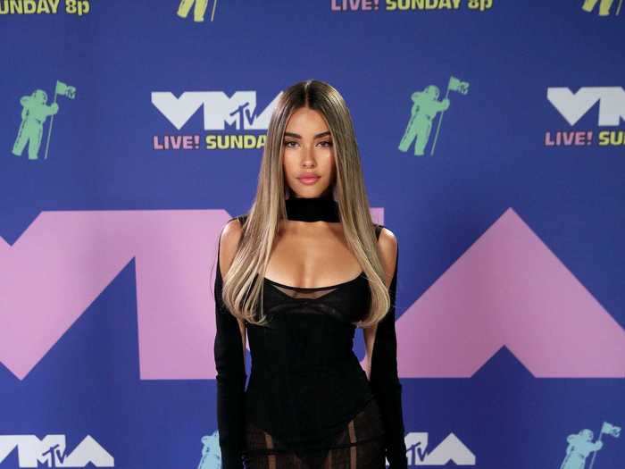 Madison Beer wore a semi-sheer minidress with black platform heels.