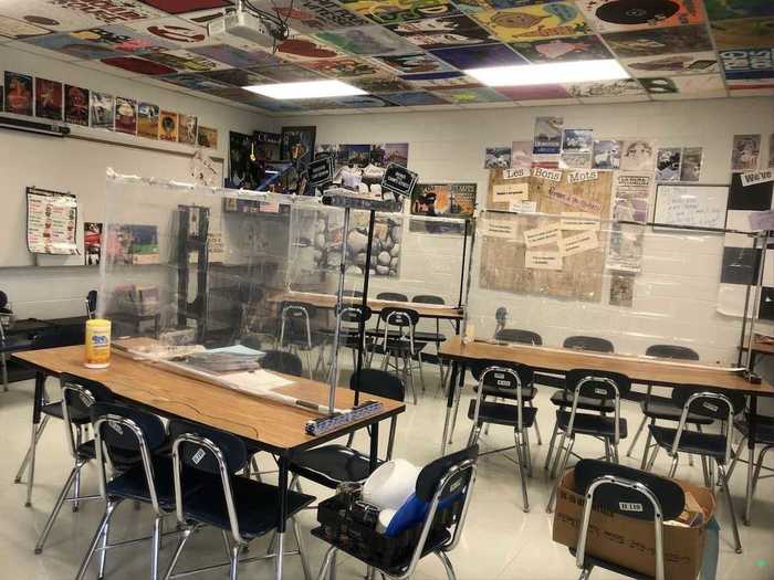 Robbins built her own desk shields using clothing racks and shower curtains.