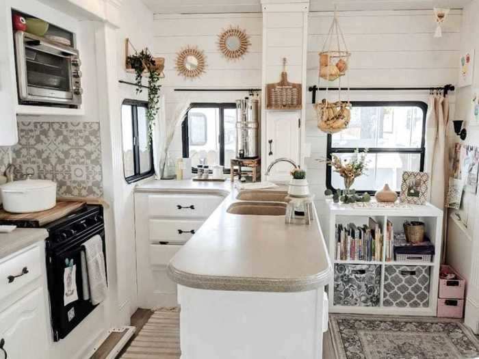 Right next to the living room, there is a bright and airy kitchen.