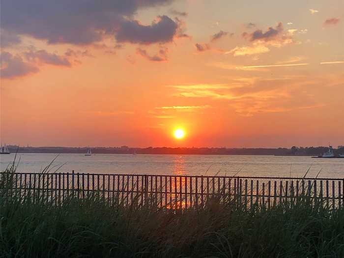 The sun setting on the water brought a dazzling array of reds and oranges — a sight I never see from my Brooklyn apartment.