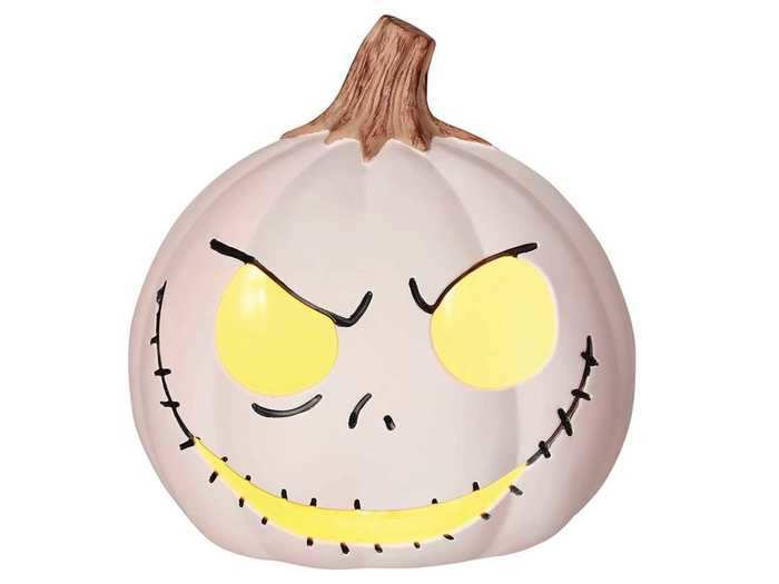 To decorate your home, you can get a light-up pumpkin featuring Jack Skellington.