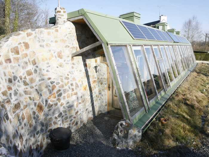 The main exterior wall was constructed with tires, while the interior walls were built using recycled bottles embedded into cement made from mud and straw.