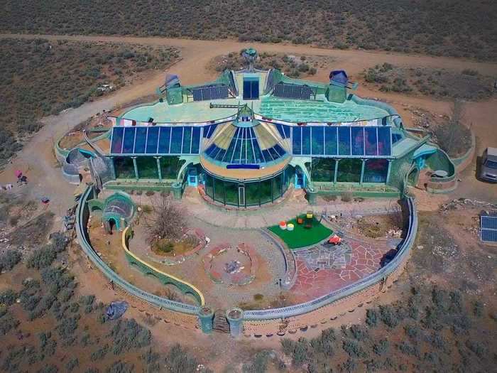 This Phoenix Earthship looks like a green and blue oasis in the middle of the New Mexico desert.