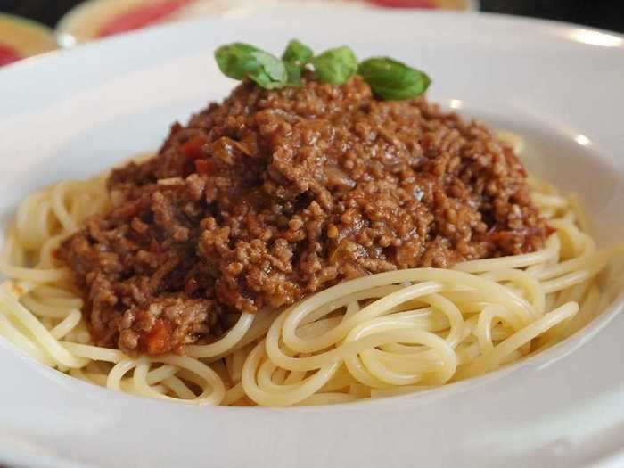 Spaghetti Bolognese is another dish that is likely cheaper to make at home.