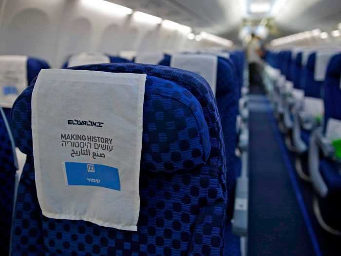 Onboard the aircraft, each seat had a headrest cover with "making history" written in English, Arabic, and Hebrew...