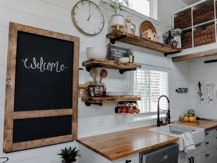 In the kitchen, they maximized space by creating a fold-down chalkboard table.