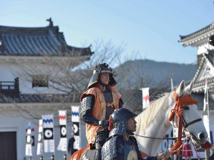 During the ceremony, a reenactor playing a feudal lord from 1617 rides in on horseback ...