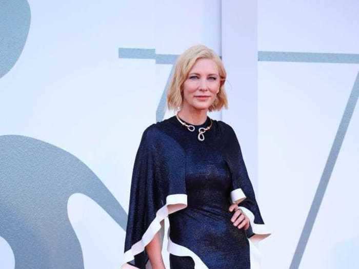 Cate Blanchett re-wore the same navy gown to the 2020 Venice Film Festival, this time carrying a blue face mask.