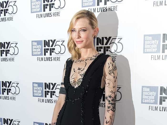 She turned heads in this Aouadi Paris black dress with sheer, "tattooed" sleeves in 2015.