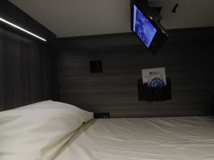 Each bunk bed has its own TV.