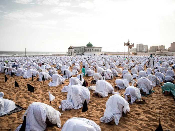 In Senegal, worshippers conduct their prayers outside, where there