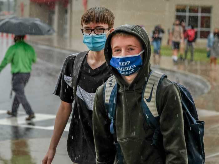 In the US, where masks are not mandatory at school, one 72-year-old cancer survivor is offering extra credit to his students who wear masks.