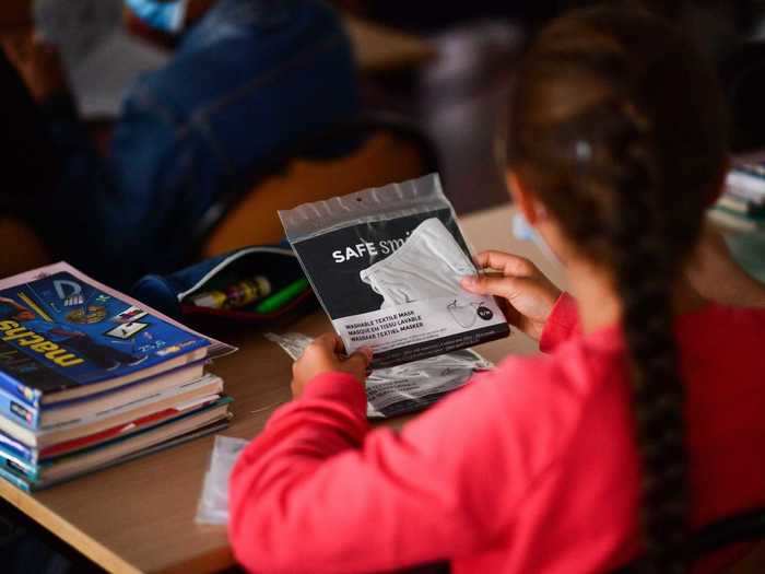 In France, where coronavirus transmission is still a concern, both students and their teachers are required to wear masks at school this year.