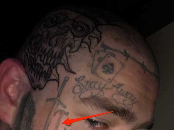 Malone also has a tattoo of a bloody hammer on his face.