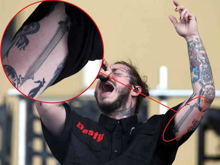 Malone has a sword on the inside of his arm.