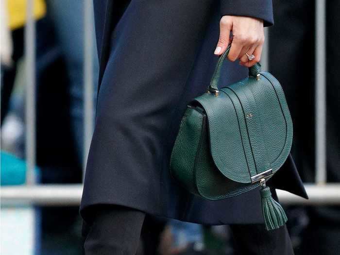 Another eye-catching fall accessory enjoyed by the duchess was this emerald green leather bag by British leather goods company DeMellier.