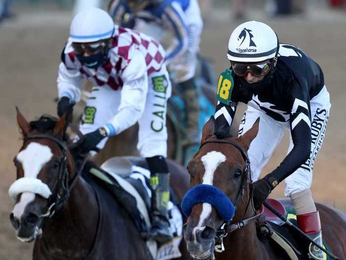 The jockeys wore face coverings alongside their usual helmets and goggles.