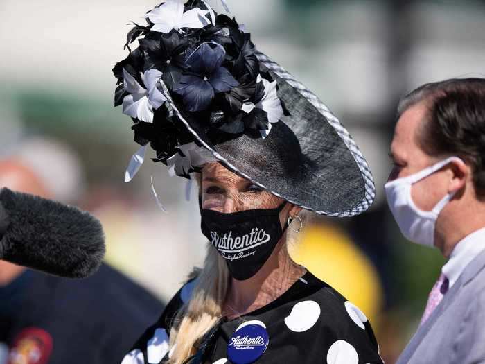 And some wore face masks customized with the name of their favorite horse. The fan pictured below is wearing a mask emblazoned with the name of the winning horse, Authentic.