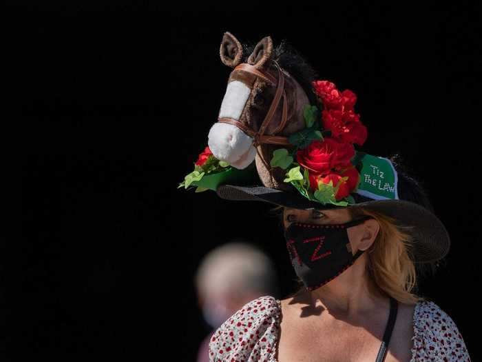 Many matched their hats to their face masks in a 2020 take on Derby fashion.
