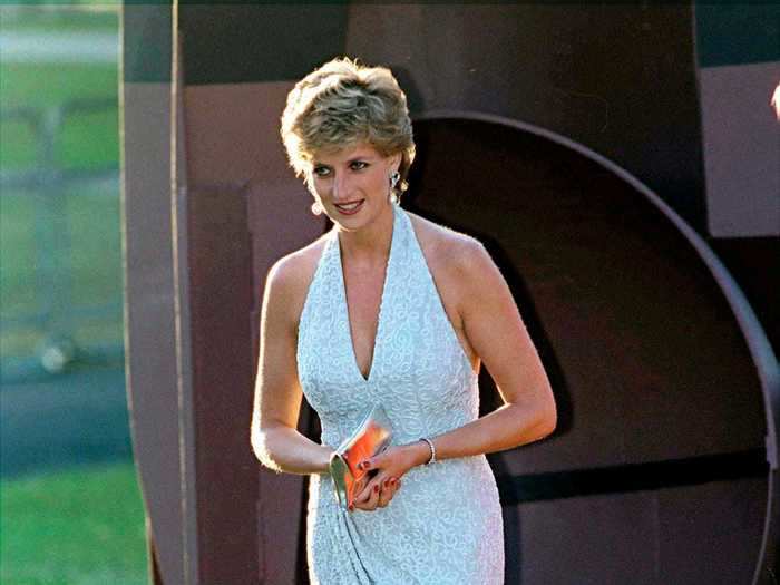 Princess Diana looked stunning in a beaded, blue midi dress during a 1995 appearance at the Serpentine Gallery.