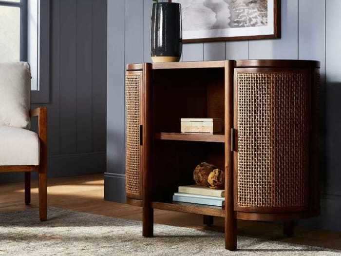 Capturing both style and convenience, this caned-door console from Target is a must.