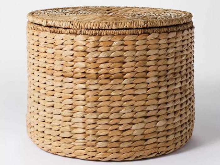 Store your blankets and books in style with a woven ottoman.