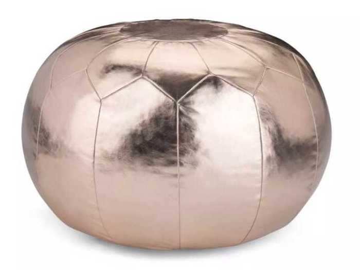 This round, metallic pouf can be used in just about any room of your home.