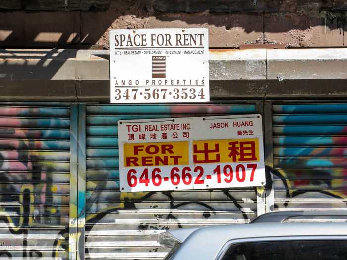 Many businesses were closed, and for rent signs were plastered over graffiti-covered shutters.