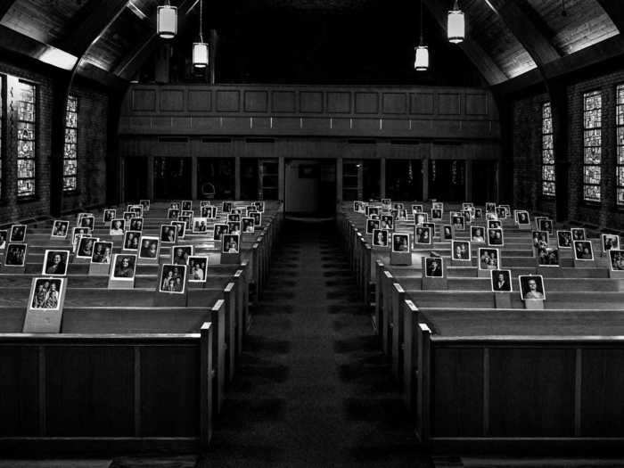 Photographs stand in for members of a church congregation on May 15.