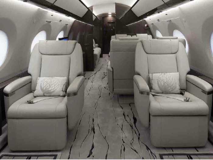 Eight club seats and two three-person divans make up the seating configuration, five seats short of the aircraft