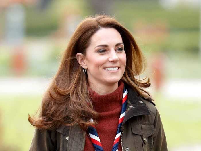 She wore another army green jacket in 2019, this time paired with a chunky maroon turtleneck sweater and a necktie.