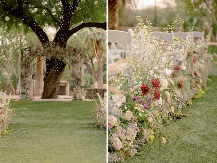 The couple got married outside under a floral archway.