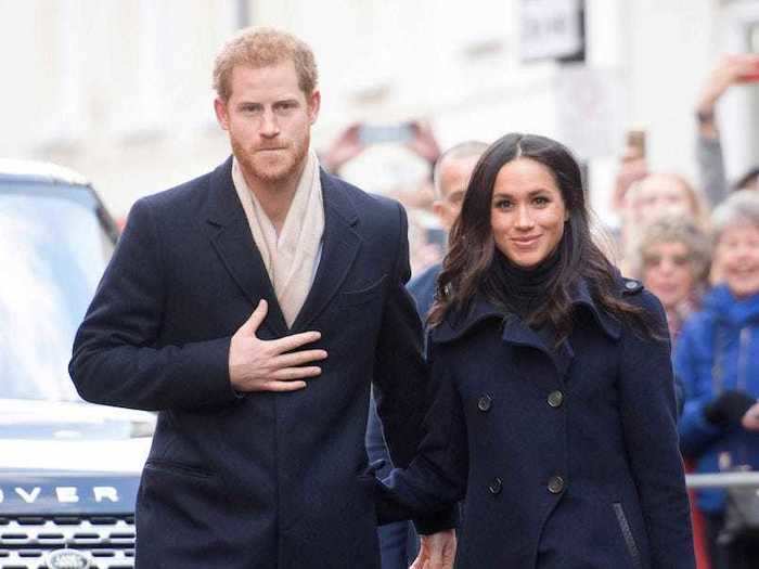 Harry matched perfectly with Markle when they stepped out in coordinating navy blue coats in December 2017.