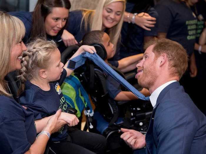 AGE 33: Less than two weeks ahead of his 34th birthday, Harry goofs around with the Riverside School Choir at the annual WellChild awards in London.