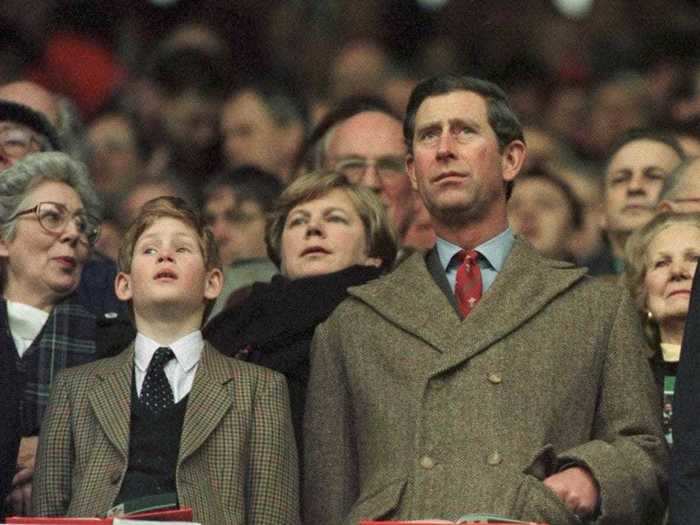 AGE 11: On February 17, 1996, Harry joins his father for the anthems during the Wales v Scotland game in the Five Nation Championship at Cardiff Arms Park in Cardiff, Wales. Charles and Diana divorced this year.