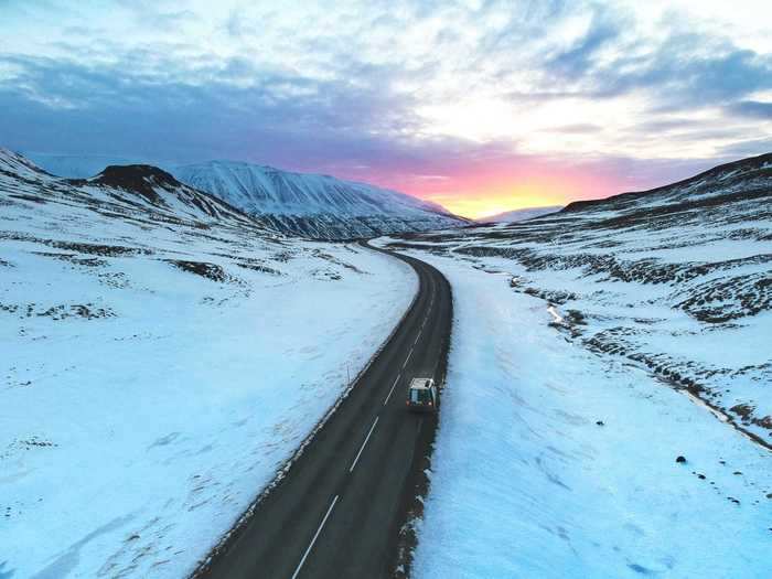 "Driving down a lonely road before the sun rises" by Roland Schwarz