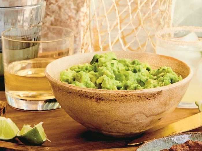 The home cook adds her Simple Guacamole after the nachos come out of the oven.